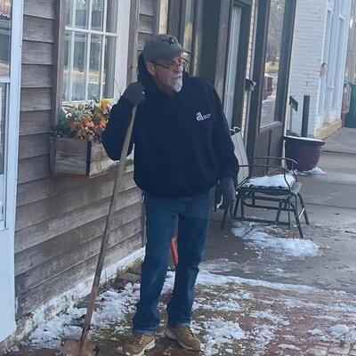 Good Help cleaning the sidewalk.